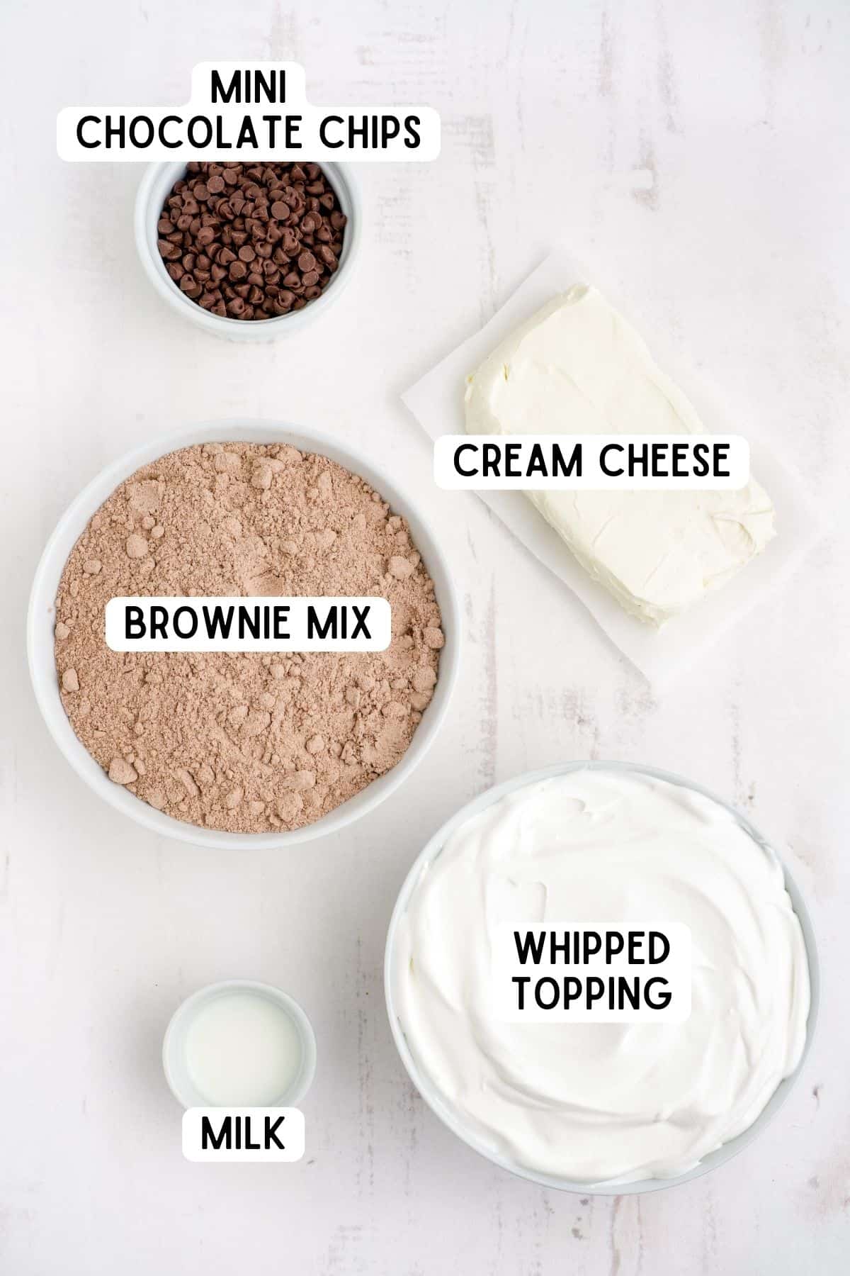 Whipped topping, milk, block of cream cheese, mini chocolate chips, and brownie mix.