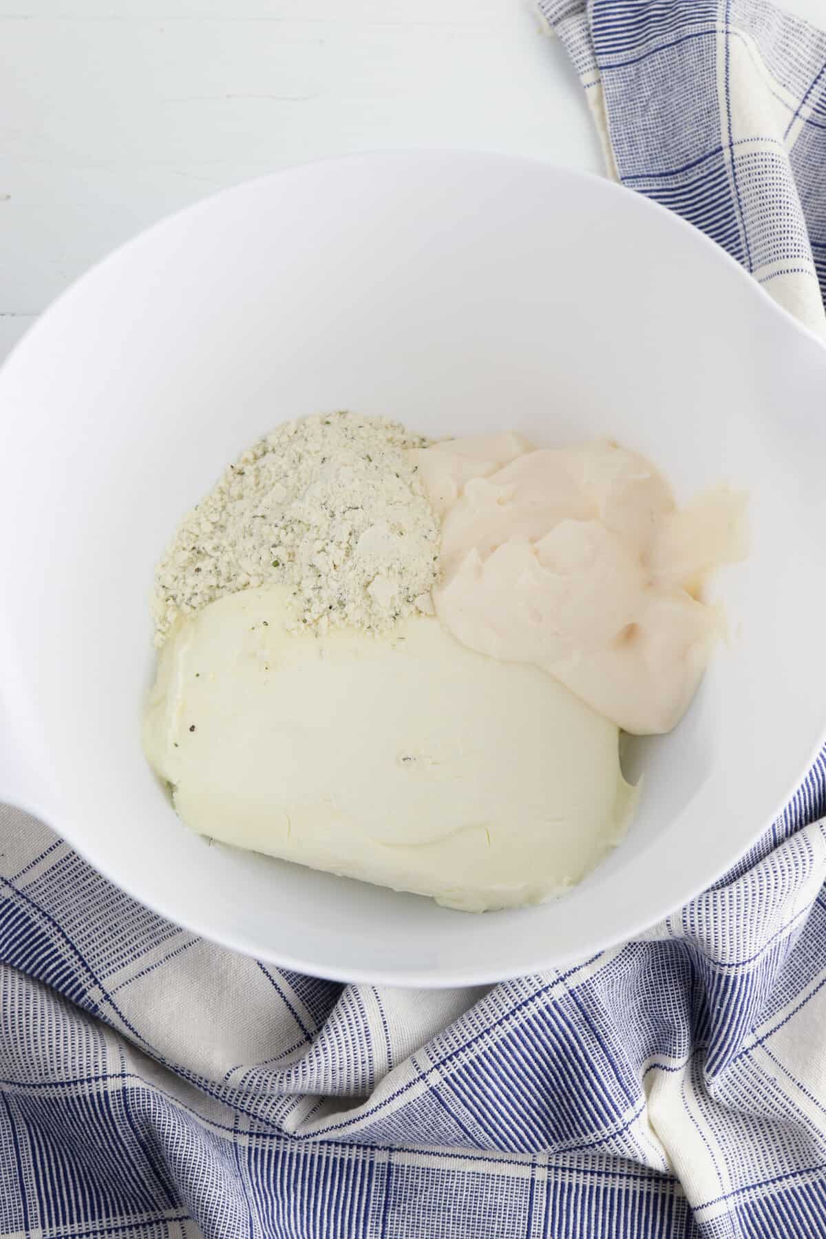 Ranch mix, cream cheese, and mayo in mixing bowl.