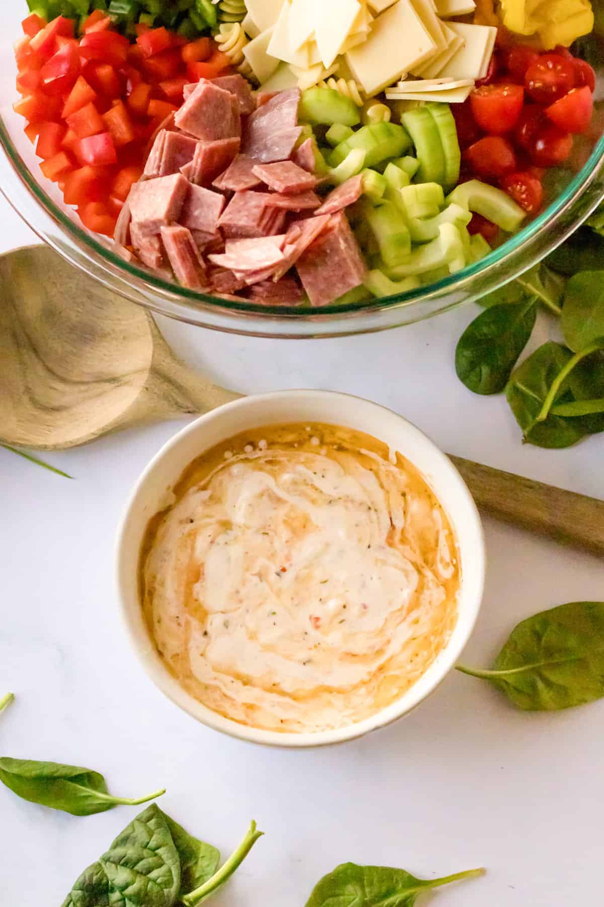 Small bowl with creamy Italain salad dressing.