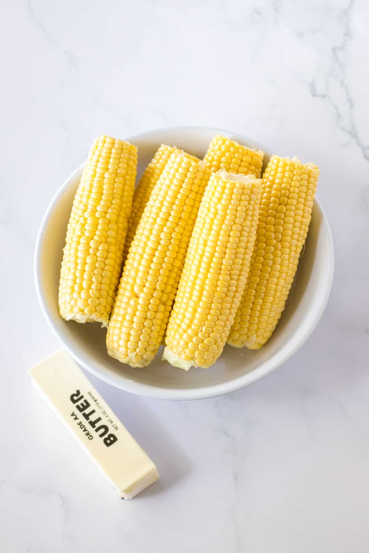 Corn on the cob and stick of butter.