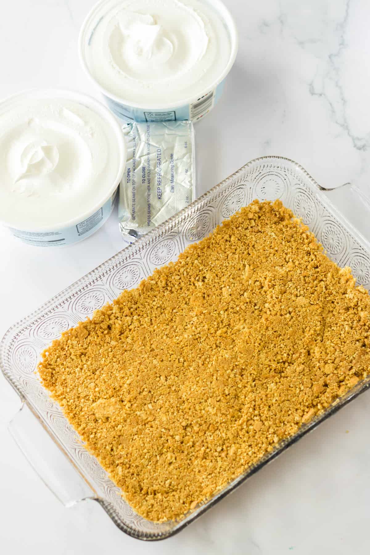 Graham cracker crust pressed in 9 x 13 glass baking dish.