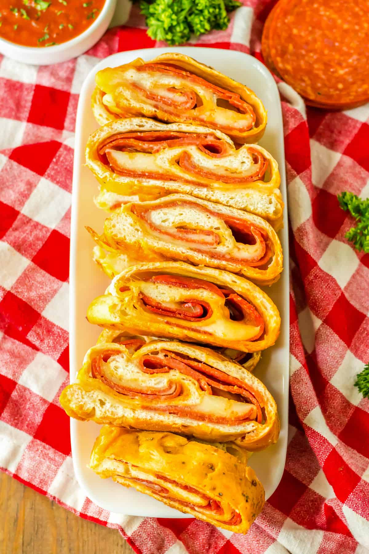 Serving tray with slices of pepperoni bread  made with mozzarella cheese and frozen bread dough.