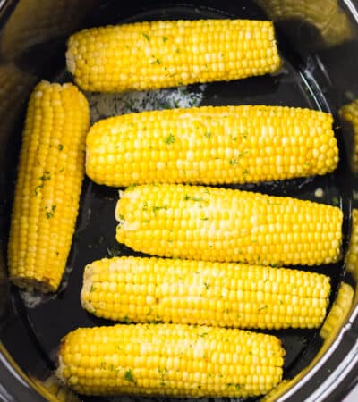 Slow cooker corn on the cob with butter and seasonings.
