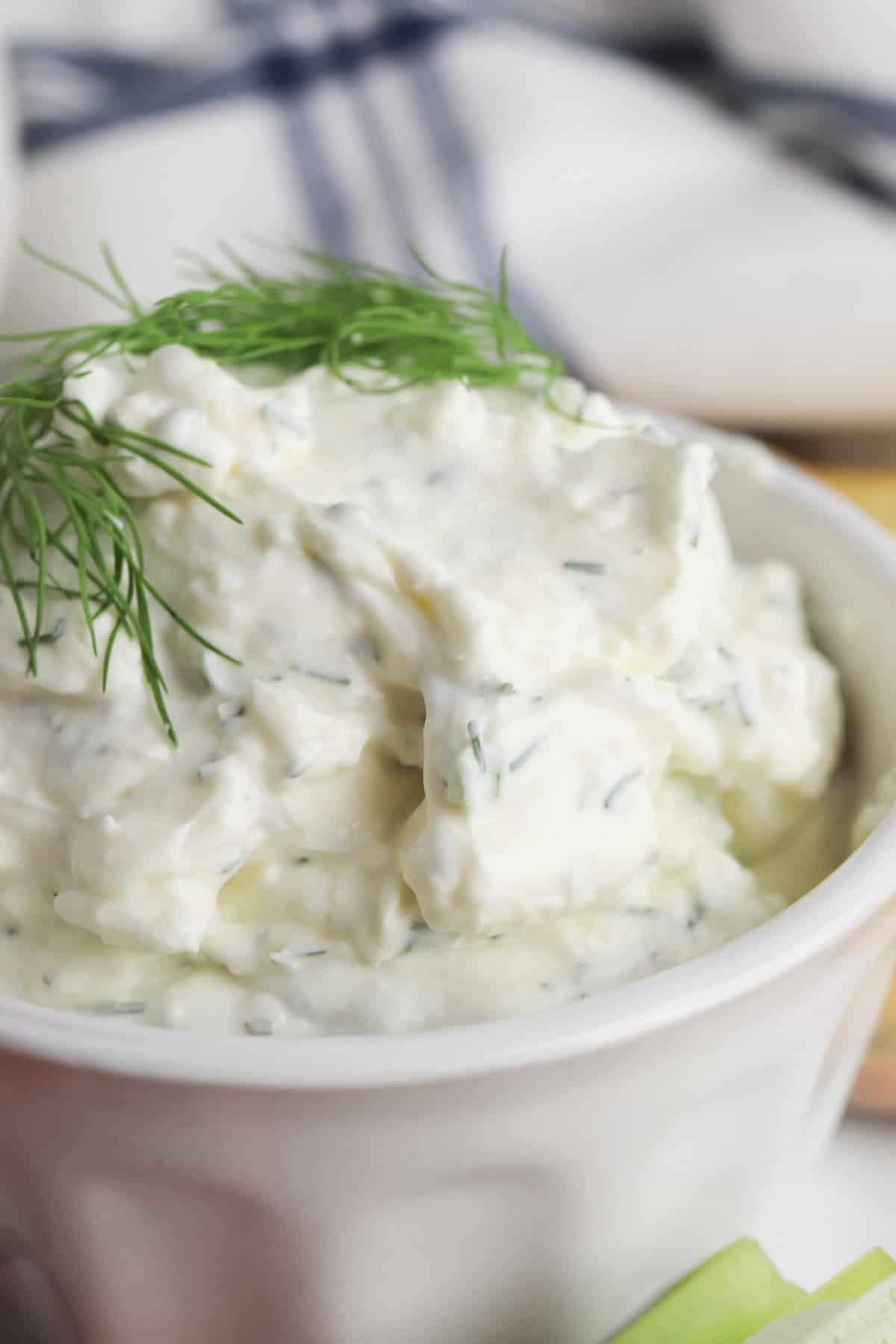 Creamy dill dip made with cream cheese, sour cream, fresh dill, green onions, and seasonings.