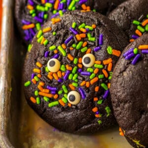 Slime filled black velvet halloween cookies with bright halloween sprinkles and candy eyes.