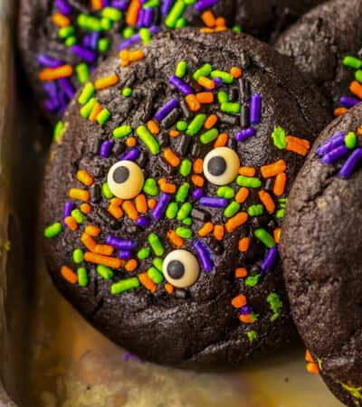 Slime filled black velvet halloween cookies with bright halloween sprinkles and candy eyes.