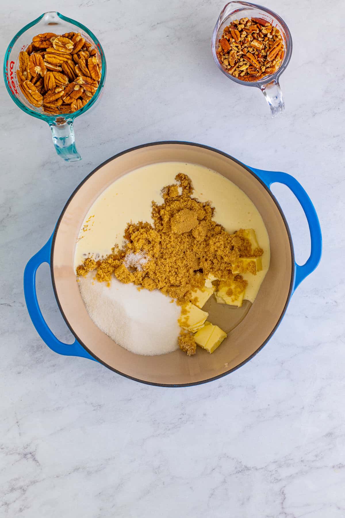 Heavy cream, brown sugar, white sugar, butter, salt, and corn syrup in a large dutch oven.