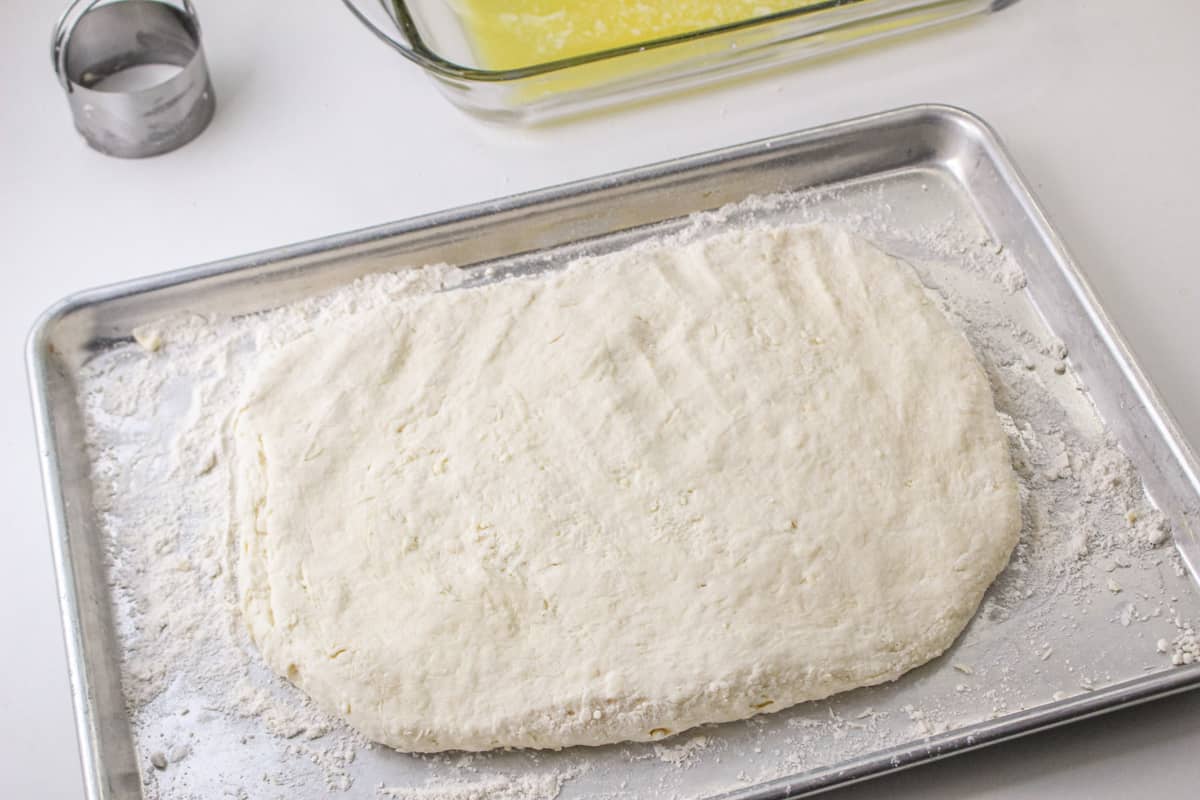 Dough pressed to about 1 inch thick on floured baking sheet.