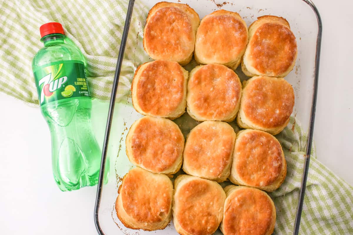 7-up Biscuits in 9x13 baking dish with bottle of 7up next to them.