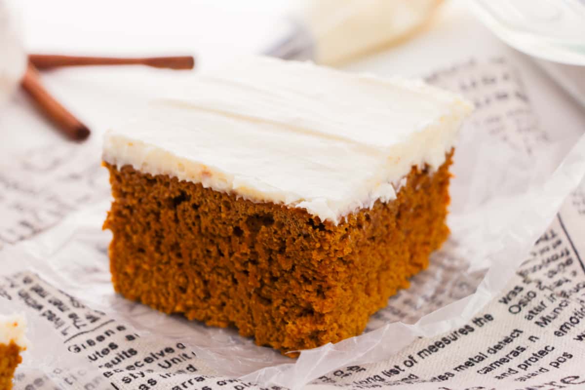 Pice of frosted pumpkin spice cake.