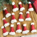Bugle Santa Hats - Bugles dipped in red chocolate and decorated with white spinkles and mini mashmallows to look like santa hats.