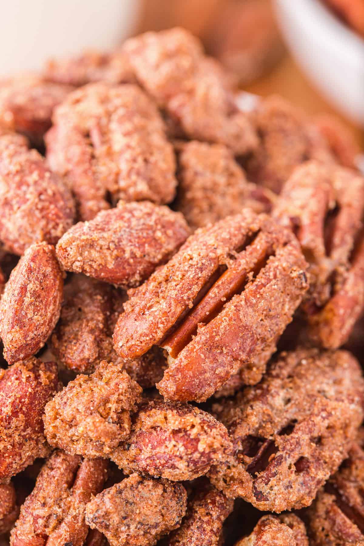 Close up of sweet and crunchy candy pecans and almonds.