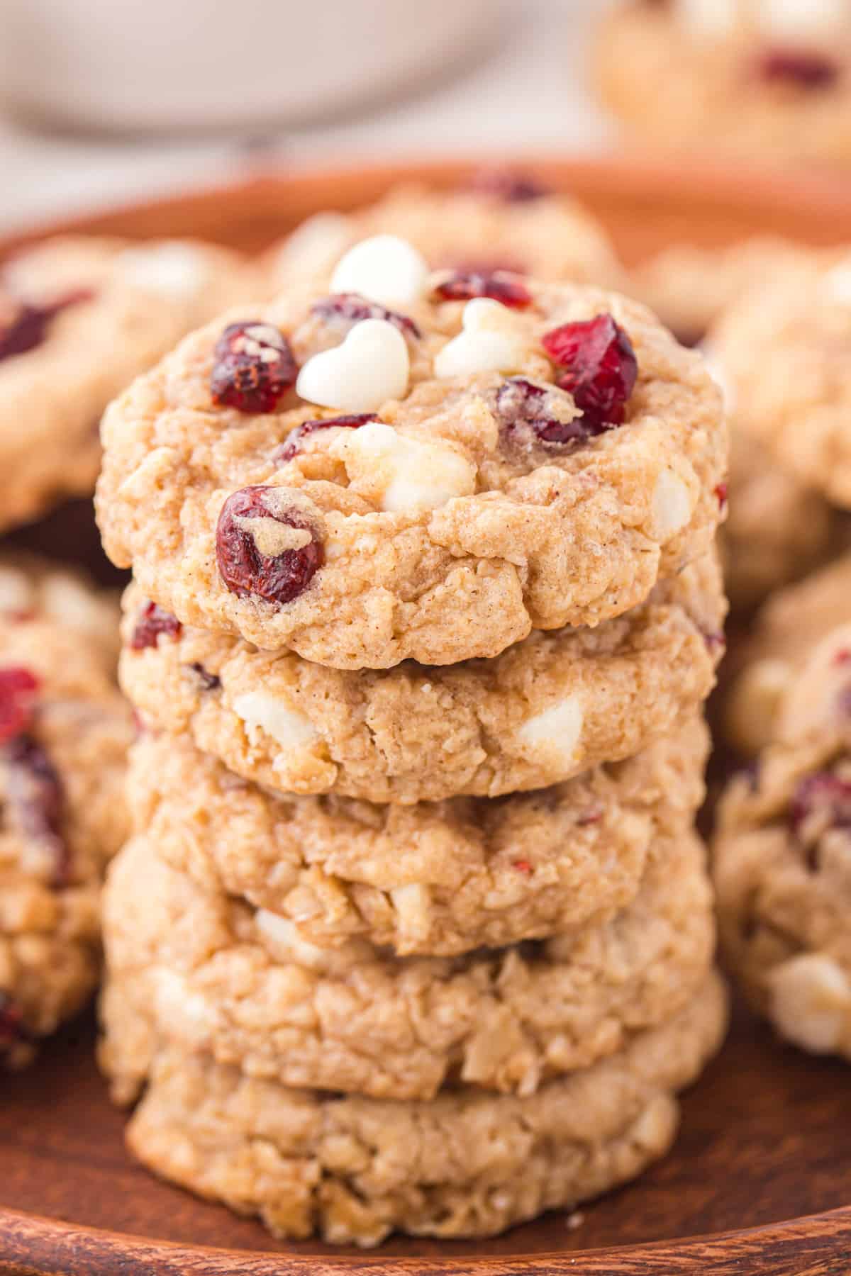 Cranberry white chocolate oatmeal cookies stacked with one on top of the other.