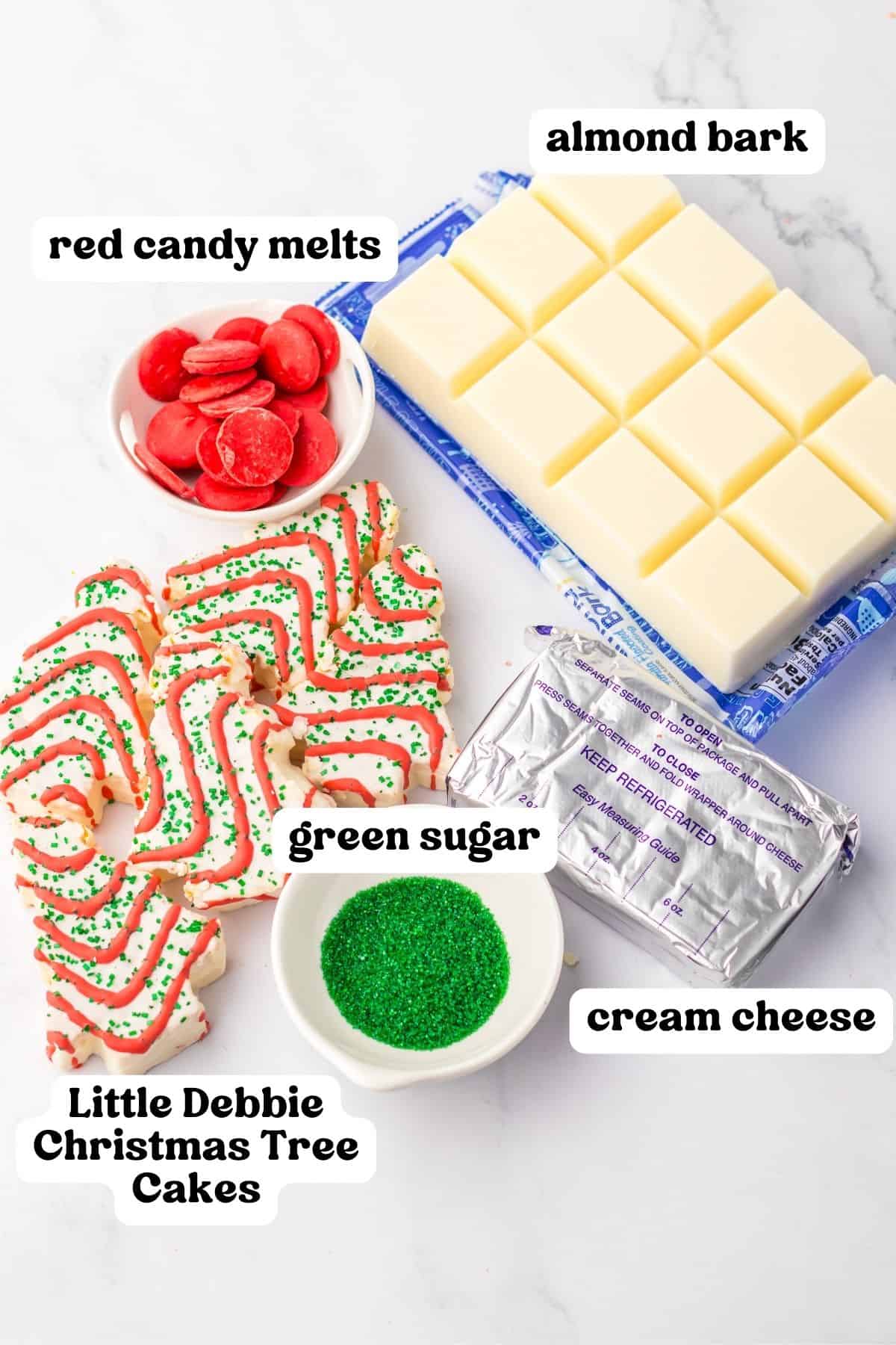 Red candy melts, white almond bark, green sugar, cream cheese, and Little Debbie Christmas Tree Cakes.