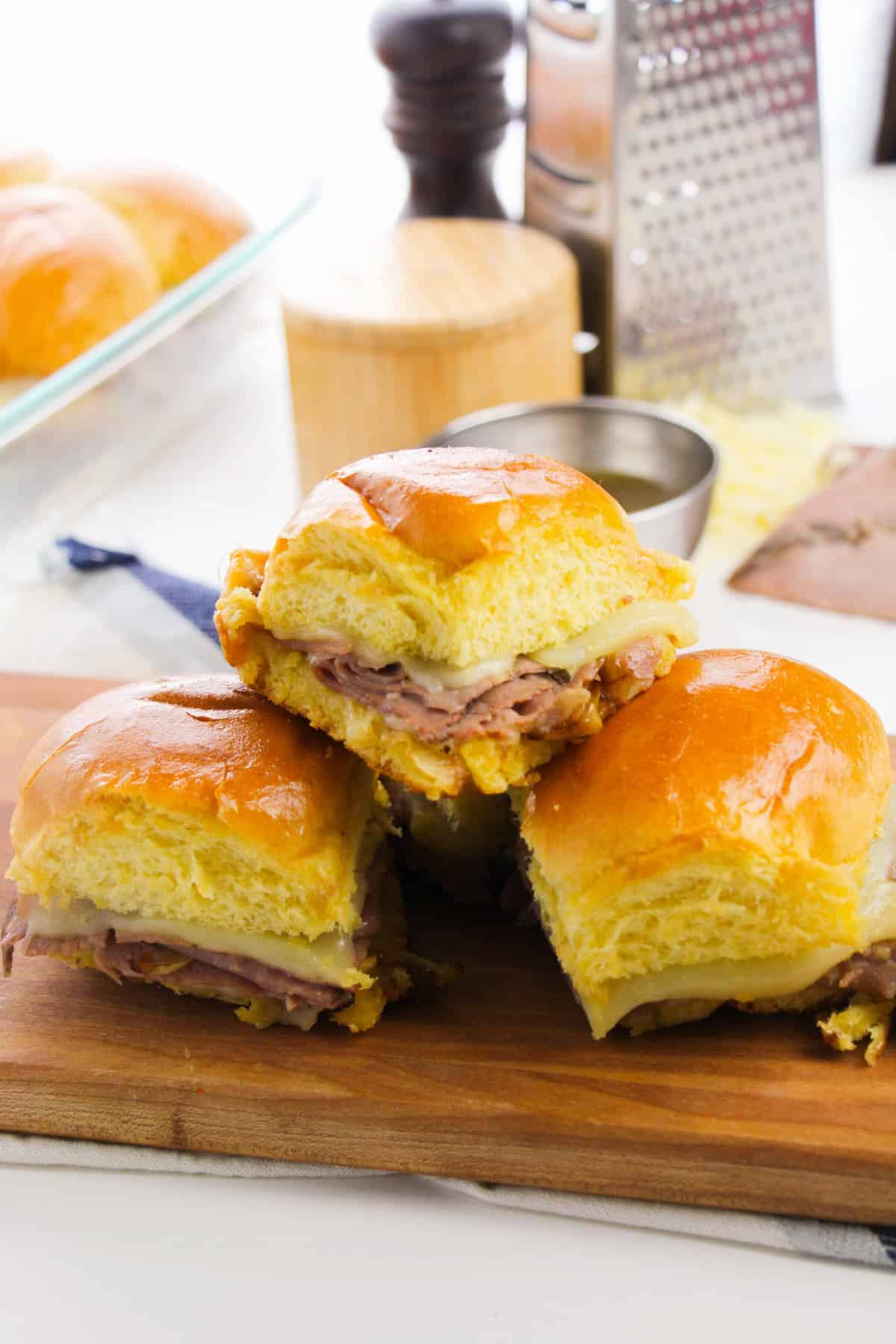 French Dip Sliders with au jus sauce for dipping.