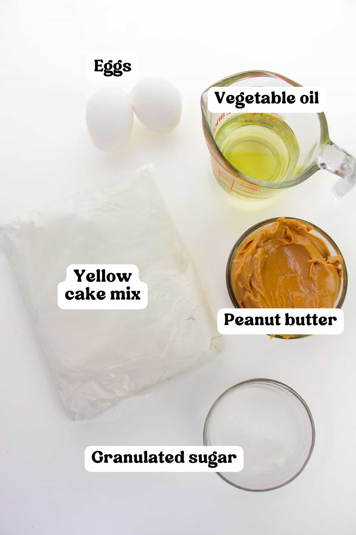 Bag of yellow cake mix, oil, peanut butter, granulated sugar, and 2 eggs.