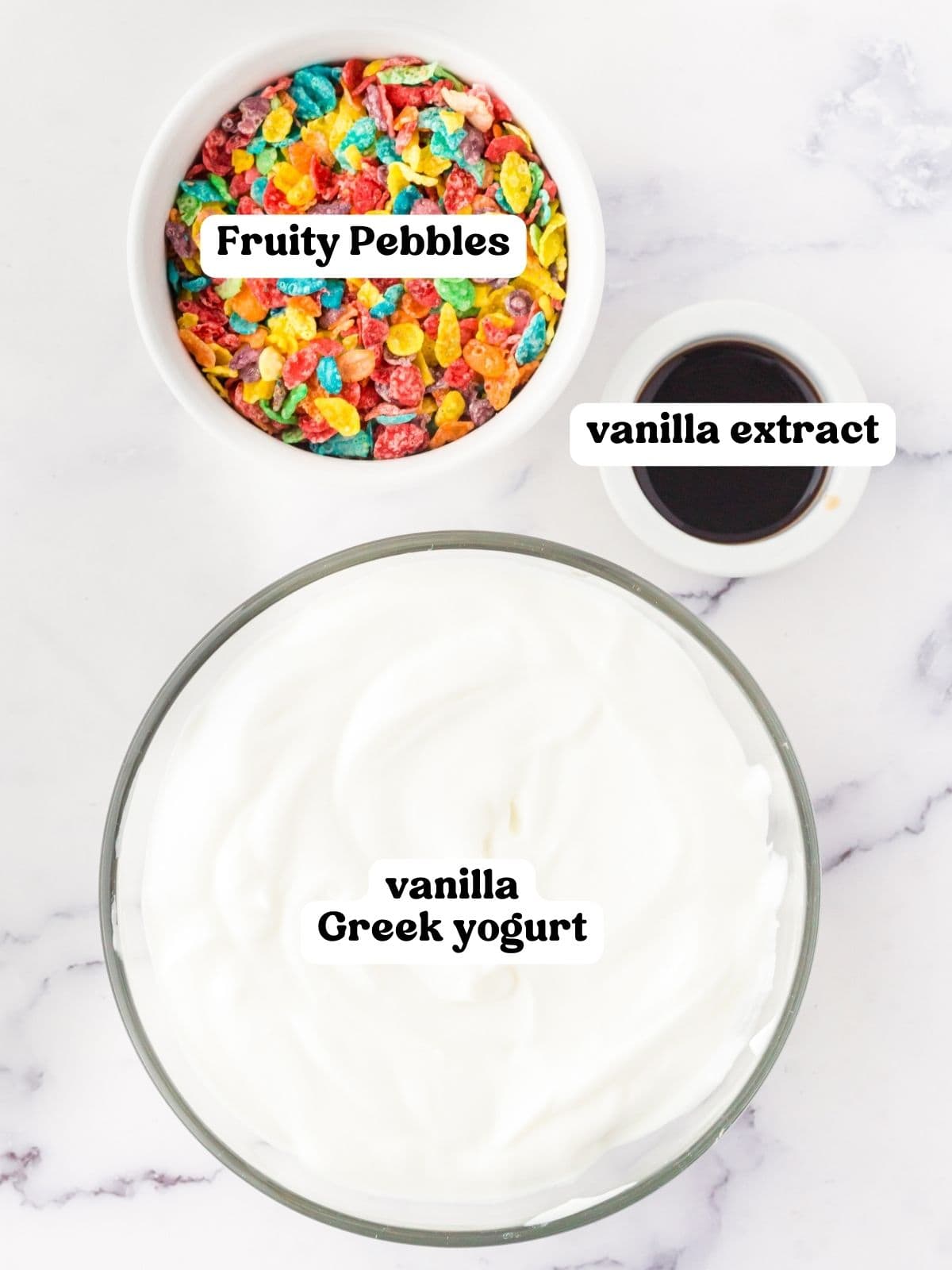 Bowls of Fruity Pebbles cereal, vanilla extract, and vanilla Greek Yogurt.