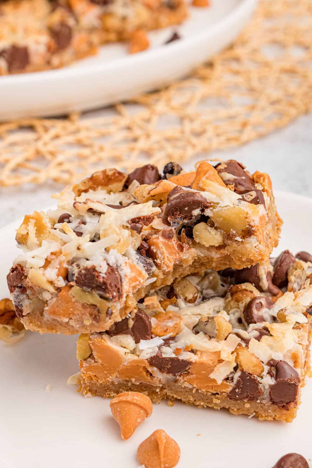 Seven layer bar cookie with bite taken out of it.