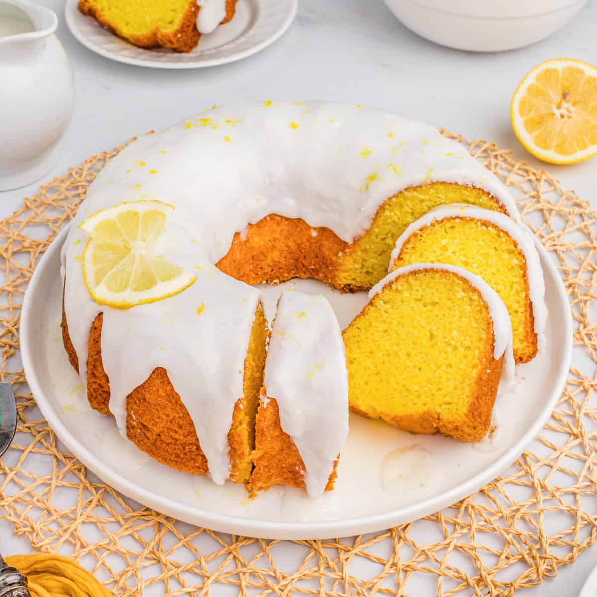 Easy lemon bundt cake made with cake mix and pudding mix and topped with a lemon glaze.