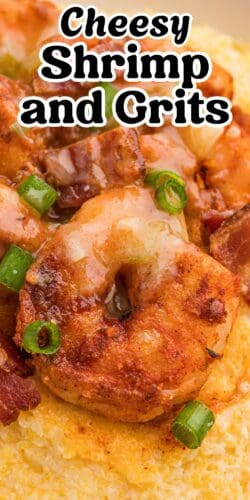 A pin image with a close-up of cooked shrimp on creamy grits, garnished with bacon and scallions. The top features the bold text "Cheesy Shrimp & Grits."