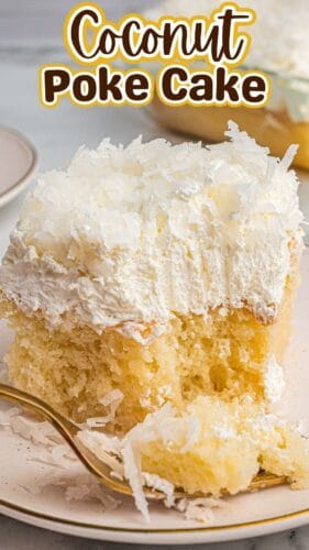 A close-up of a plated slice of coconut poke cake with a bite taken out and a fork resting beside it. The top section includes text reading “Coconut Poke Cake."