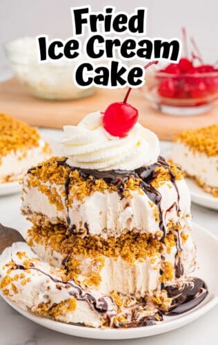 Fried ice cream bars layered and topped with crispy cornflake topping, chocolate syrup, whipped cream, and a cherry. Text above reads "Fried Ice Cream Cake."