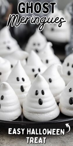 a close-up of ghost-shaped meringues with black candy faces arranged on a dark plate. Text at the top reads “Ghost Meringues,” and at the bottom, “Easy Halloween Treat.”