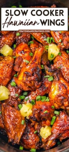Collage pin showing glazed crockpot Hawaiian chicken wings topped with pineapple and green onions. Bold top text reads “Slow Cooker Hawaiian Wings,” with the source “crayonsandcravings.com” below.