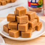 Stack of peanut butter fudge on a white plate.