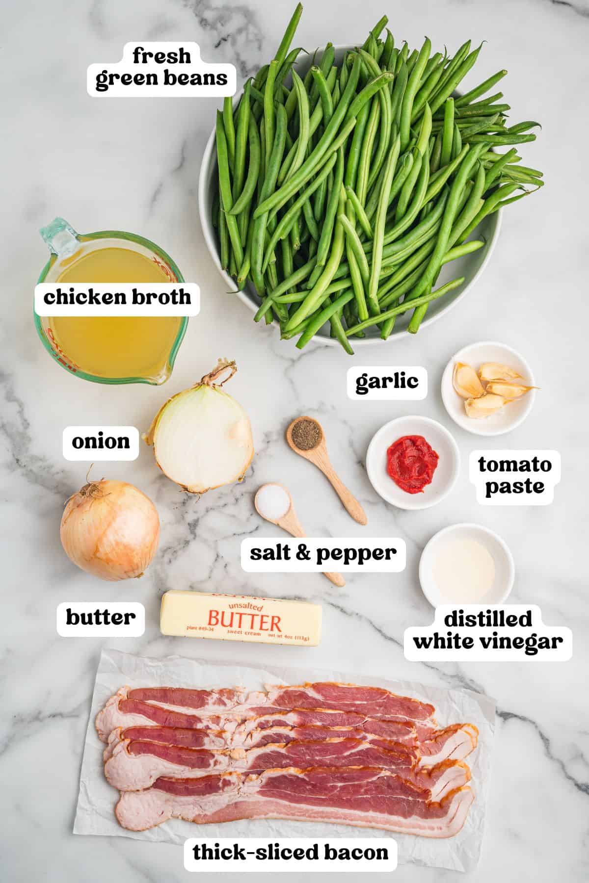 Ingredients labeled with text. Items include fresh green beans, chicken broth, onion, butter, thick-sliced raw bacon, garlic cloves, tomato paste, salt and pepper, and distilled white vinegar.