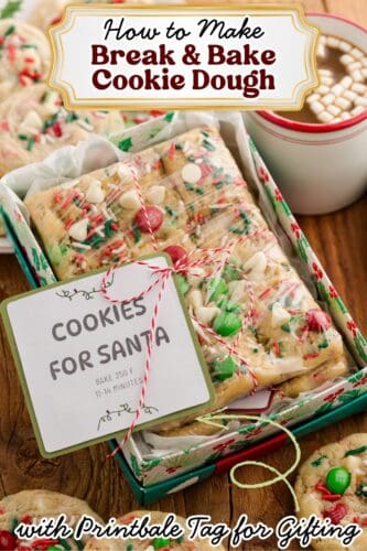 a box of break-and-bake Christmas cookie dough wrapped in plastic and tied with red and white string. Topped with a label that says “Cookies for Santa.” The cookie dough is decorated with M&Ms, white chocolate chips, and holiday sprinkles. Text at the top reads “How to Make Break & Bake Cookie Dough,” and text at the bottom reads “with Printable Tag for Gifting.”