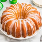 7 Up pound cake with glaze drizzled over the top.