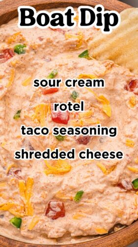 Creamy dip in a wooden bowl with a ruffled chip. Overlay text: Boat Dip, sour cream, rotel, taco seasoning, shredded cheese.