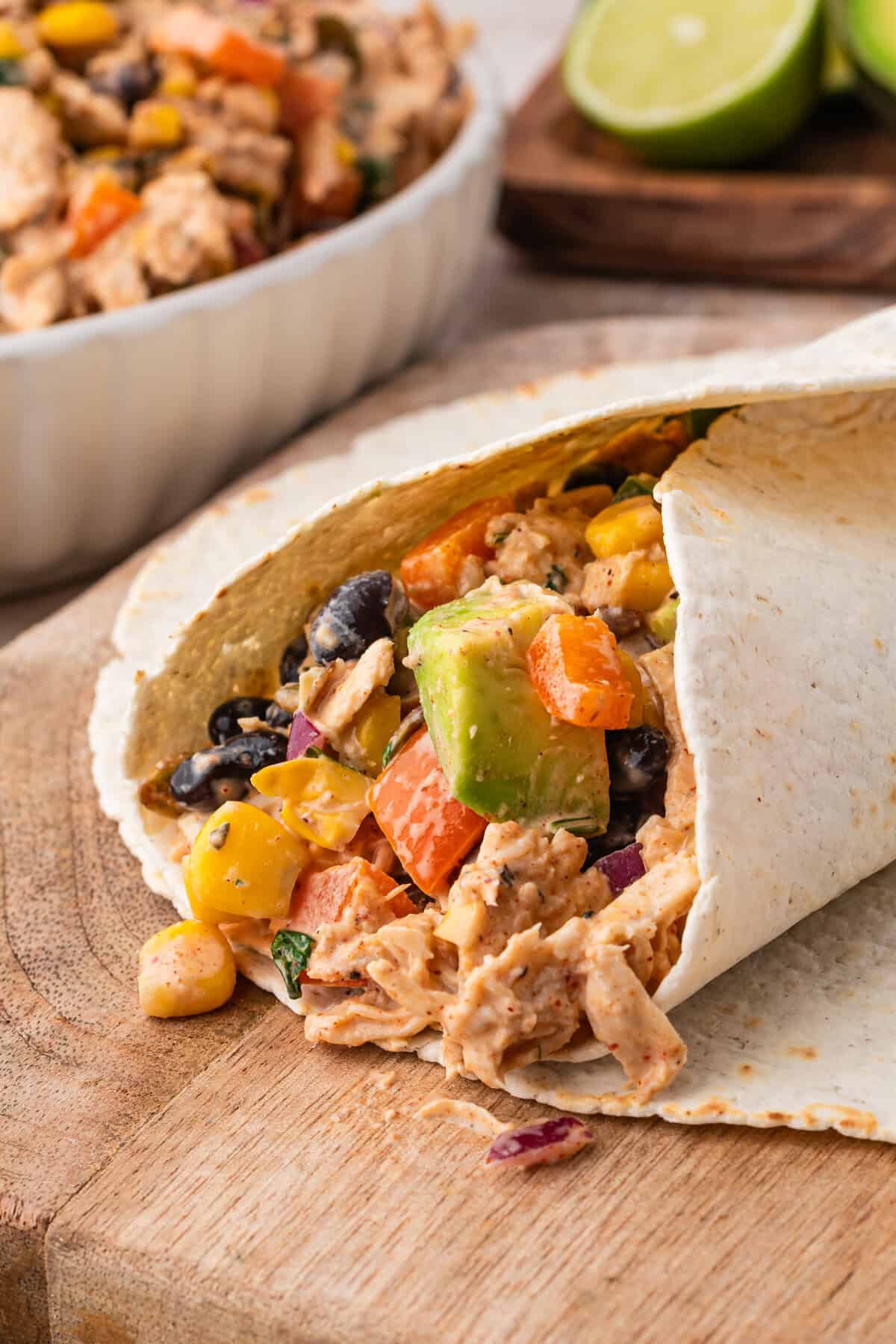 Southwest chicken salad wrapped in a flour tortilla with avocado, corn, black beans, and peppers.