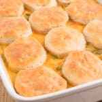Easy chicken pot pie casserole with biscuits and cheese.