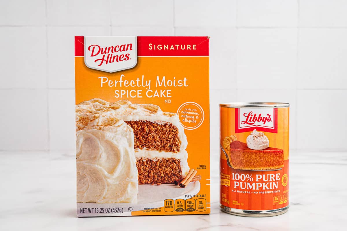 A box of Duncan Hines spice cake mix and a can of Libby's pure pumpkin on a counter.